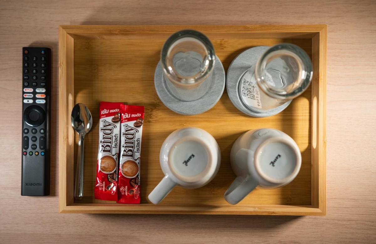 In-room welcome tray with coffee and ceramics