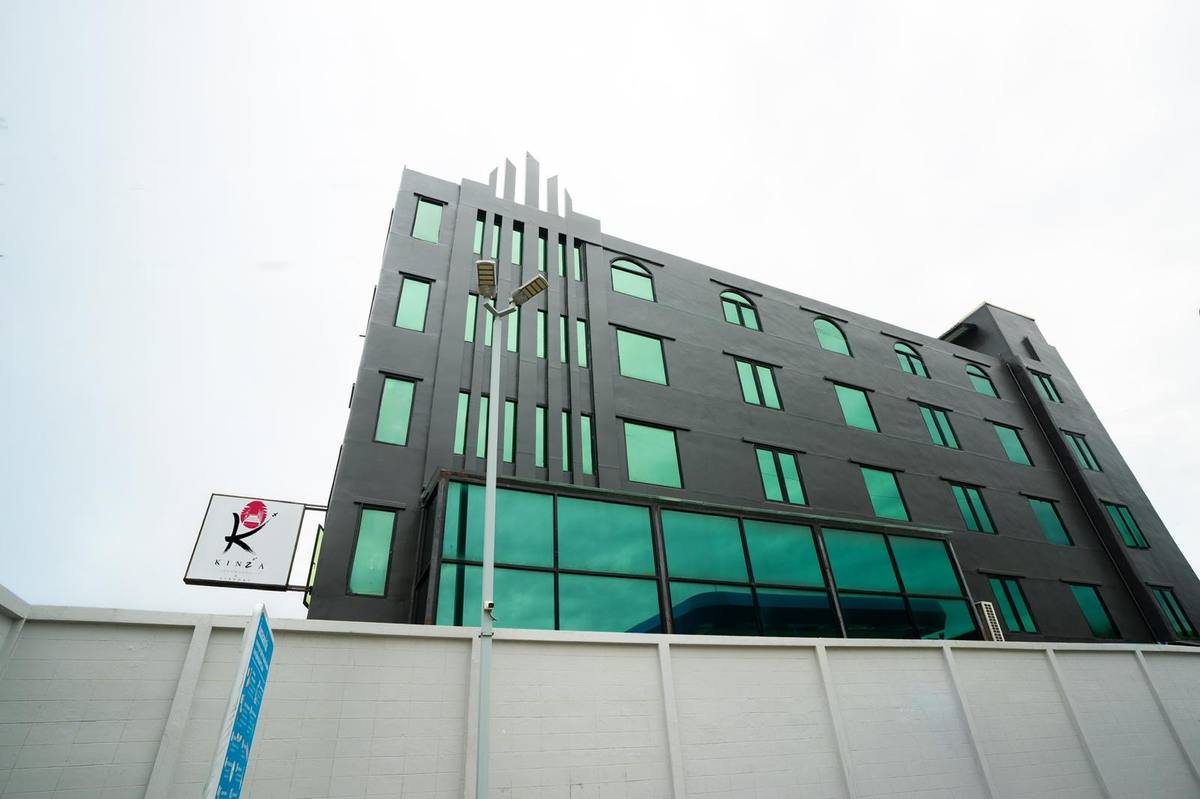 Looking up at the modern charcoal facade