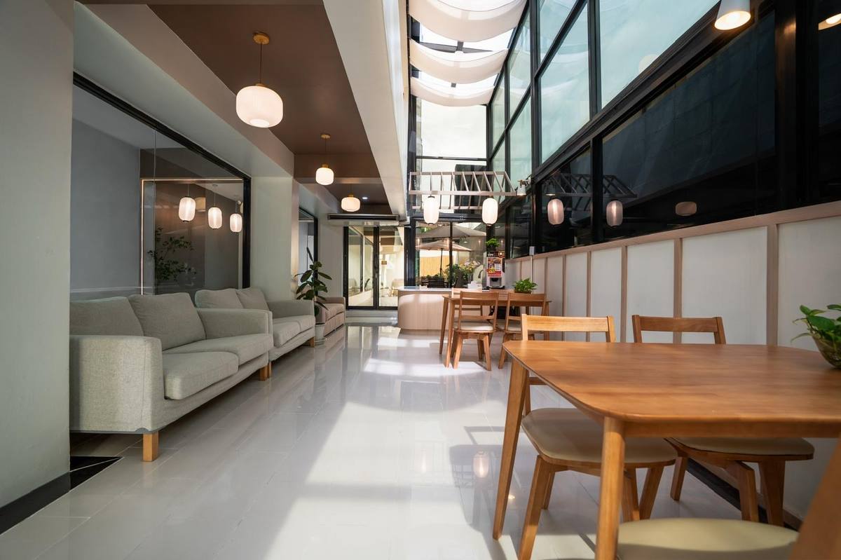 Lounge seating with linen sofas and wooden tables