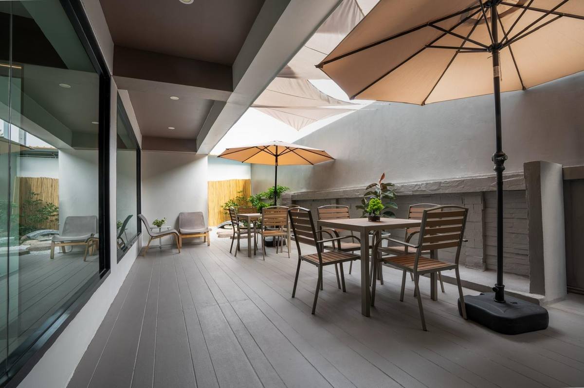 Outdoor terrace with umbrellas and seating